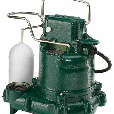 Technician installing a sump pump in a basement to prevent flooding | effective basement solutions